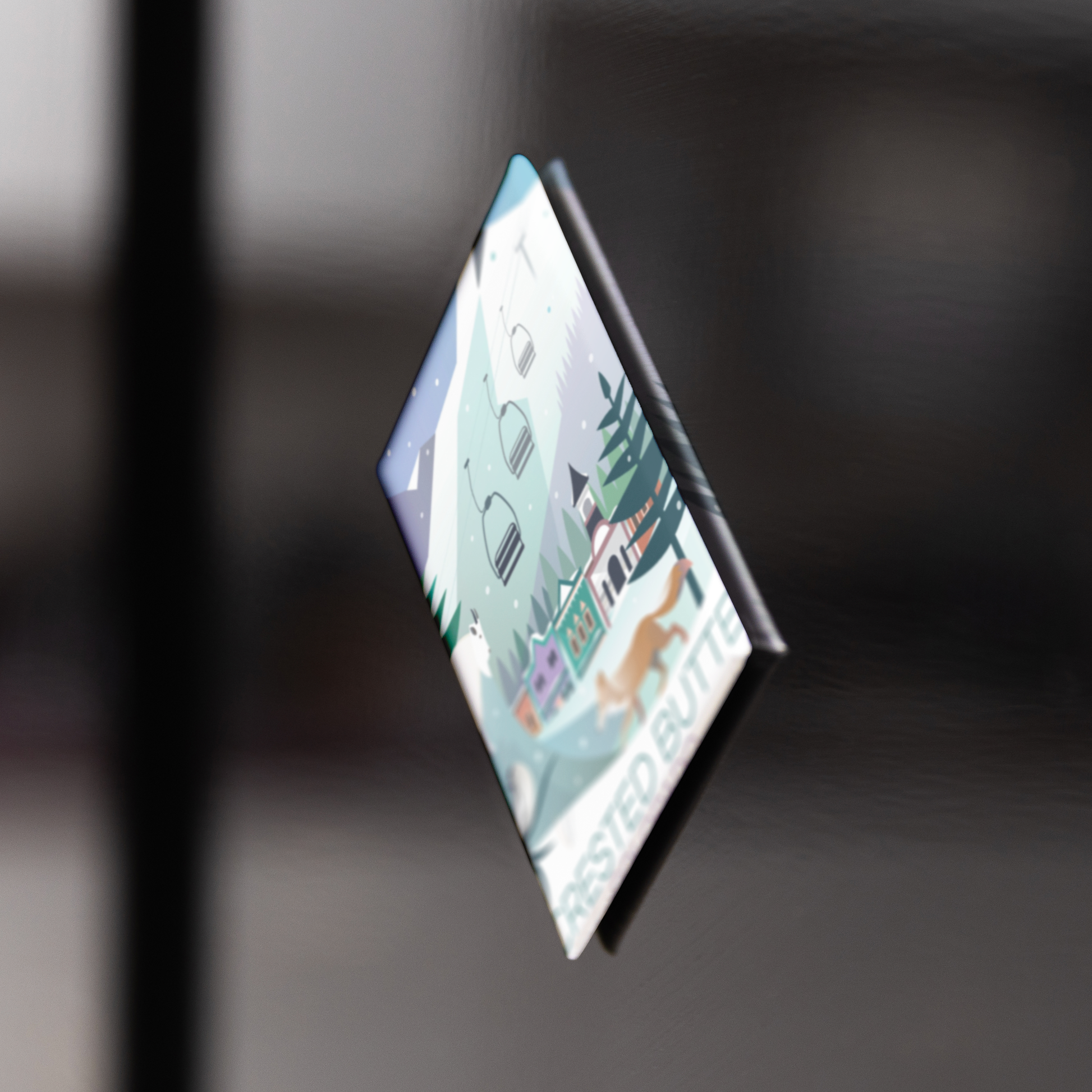 Crested_Bute_Winter_RectangleButtonMagnet_V_BlackFridge_Mockup.png